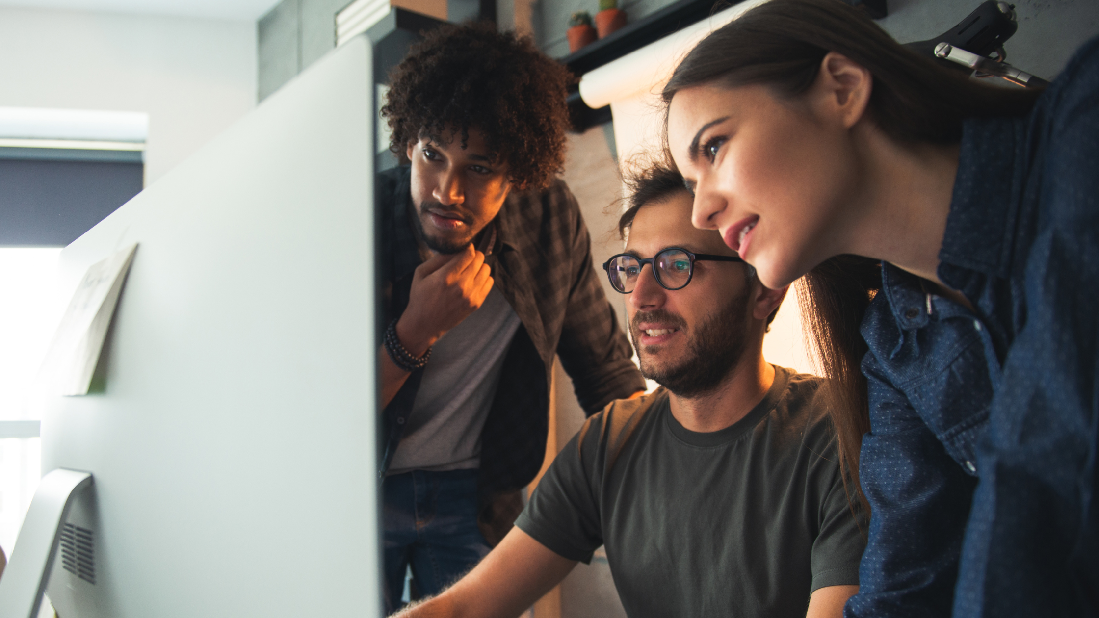 Startup team collaborating on project management tools to optimise workflows and improve productivity using dashboards and software.