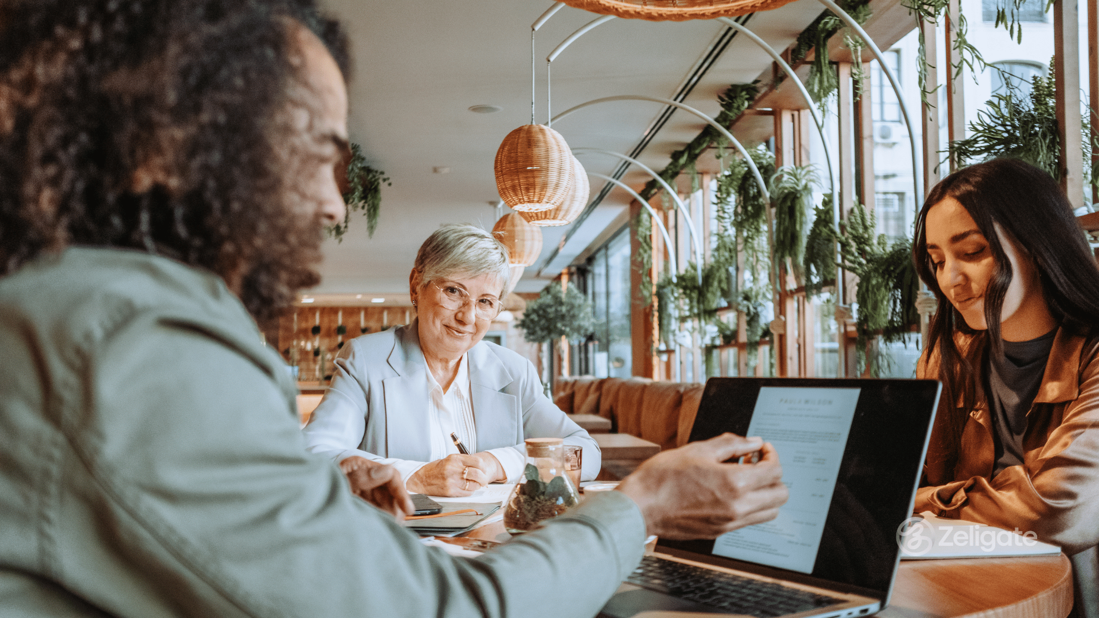 image of man and two ladies taking part in a job interview.